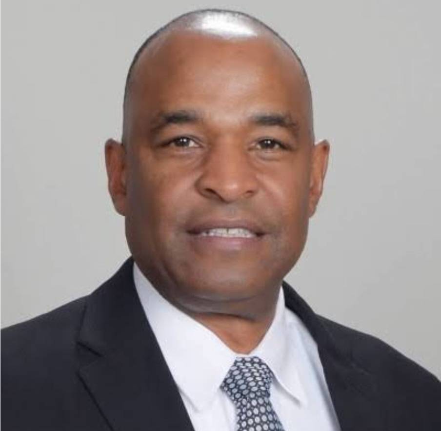 Head shot of Kevin Vereen in suit and tie.