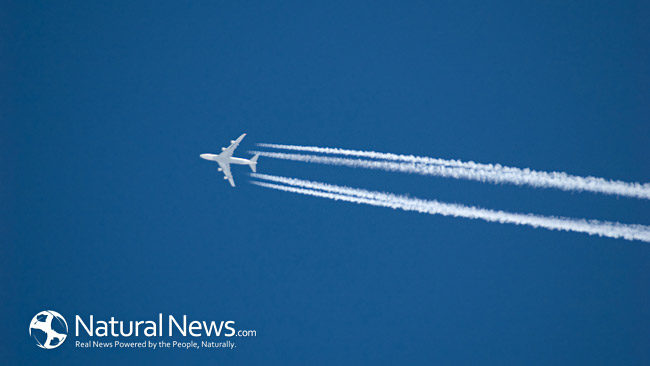 An airplane leaves a trail across a clear blue sky.
